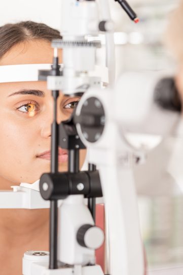 Woman at eye lens test, healthcare for vision by optician for contact lens and focus with laser med
